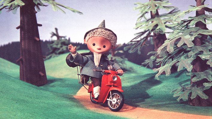 Der Sandmann fährt auf einem Moped Der Sandmann fährt auf einem Moped